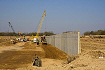 US / Mexico Border wall construction in progress in Hidalgo County, Lower Rio Grande Valley wildlife corridor, Texas, USA ILCP RAVE January/February 2009