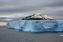 Floating iceberg, with Paulet Island behind, Antarctic Sound, Antarctic Peninsula, February 2006