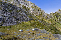 Tourist helicopters at Kakapo Castle, Fiordland National Park, South Island, New Zealand, January 2009