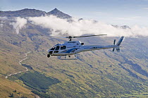Helicopter flying over Fiordland National Park, South Island, New Zealand, January 2009