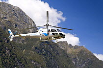 Helicopter flying over Fiordland National Park, South Island, New Zealand