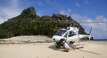 Film crew helicopter on beach, Fiji, Melanesia, Pacific Ocean, September 2007