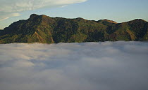 Mountain range seen above the clouds, Fiji, Melanesia, September 2007