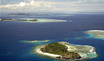 Aerial view of small islands with fringing coral reefs off Fiji, Melanesia, Pacific, September 2007