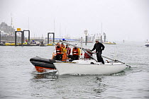 "Sonar" dismasted, being recovered by a safety boat. Cowes Week, August 2009.