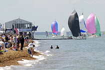 Spectators watching race from the Green, Cowes Week, August 2009. Fleet includes "Munkenbeck" and "Enigma".