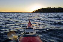 Voew from kayak on at dawn on Lake Winnipesauke in Meredith, New Hampshire, USA. October 2007