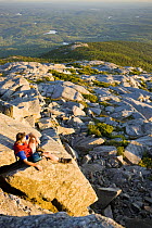 Hiker on the summit of Mount Monadnock, Monadnock State Park, New Hampshire, USA, August 2008
