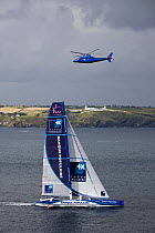 Helicopter flying over Maxiyacht "Banque Populaire V", skippered by Pascal Bidégorry, crossing the finish line at Lizard Point, Cornwall, for a new North Atlantic Record, in 3 days, 15 hours, 25 minu...