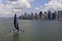 Maxi trimaran "Banque Populaire V", skippered by Pascal Bidégorry, arriving in Manhattan, New York, for North Atlantic record attempt. 27 June 2009.