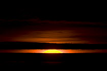 Sunrise seen from out on the pack ice, outside the Inupiaq village of Point Hope, Chukchi Sea, Alaska, October 2008