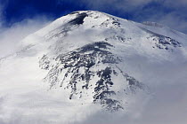Mount Elbrus, the highest mountain in Europe (5,642m) surrounded by clouds, Caucasus, Russia, June 2008
