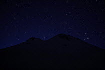 Stars above Mount Elbrus at night, highest mountain in Europe (5,642m) Caucasus, Russia, June 2008