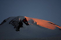 First red light on Mount Elbrus (5,642m) the highest mountain of Europe, Caucasus, Russia, June 2008