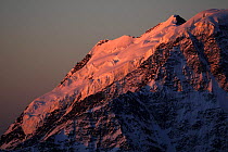 Early morning, red light on the glacier on Mount Donguzorun (4,468m) seen from Elbrus, Caucasus, Russia, June 2008