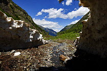 Alibek valley near Dombay seen from inside an ice-cave, Teberdinsky biosphere reserve, Caucasus, Russia, July 2008