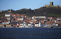 Scarborough harbour, seafront and castle. North Yorkshire, UK, March 2009