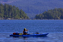 Kayaker on Barkley Sound, Vancouver Island, British Columbia, Canada