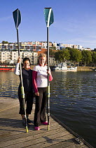 Annie Januszewski and Mel King before rowing the Atlantic in the WoodVale Challenge. Bristol Floating Harbour, 17th September 2009. Model Released.