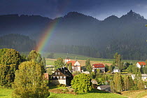 Rainbow over Jetrichovice with Ceske Svycarsko / Bohemian Switzerland National Park behind, Czech Republic, September 2008