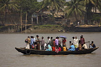 Passenger ferry / shuttle taking people across the Rupsha river at Khulna, Khulna Province, Bangladesh. March 2006