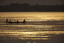 Shrimp fry fishing boats on the Sibsa River at sunset, Sundarbans, Khulna Province, Bangladesh, March 2006