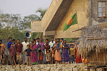 Villagers from Nolian Village watching our boat and waving to us, Khulna Province, Bangladesh, March 2006