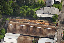 Aerial view of charcoal factory, using wood from the Matang mangrove forest, Taiping vicinity, Perak, Malaysia. May 2006
