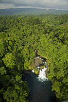 Aerial view of waterfall and rain forest near Punta Dolores, south coast region of Bioko Island, Equatorial Guinea, Central Africa. January 2008