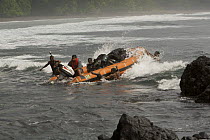Zodiac boat landing research equipment and people through the surf at Moraka Playa base camp on the South coast of Bioko Island, Equatorial Guinea, Rapid Assessment Visual Expedition, International Le...
