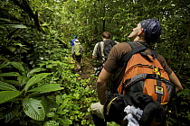 Expedition crew members hike in the forest of Bioko Island, Equatorial Guinea, Rapid Assessment Visual Expedition, International League of Conservation Photographers, January 2008. Model released