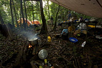 Cooking breakfast at the campsite in the rainforest of Bioko Island. Intermediate camp (Camp Peter) on the trek into the Caldera. Bioko Island, Equatorial Guinea, Rapid Assessment Visual Expedition, I...