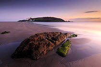 Burgh Island with Burgh Island hotel in evening light at low tide, from Bigbury Bay, South Devon, UK, September 2009