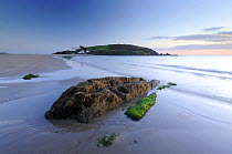 Burgh Island and Burgh Island hotel in evening light at low tide, from Bigbury Bay, South Devon, UK, September 2009