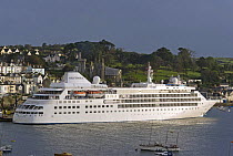 Cruise ship "Silver Cloud" entering Fowey harbour in the early morning, Cornwall, UK. September 2009.