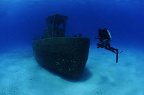 Cameraman Michael Pitts on wreck of the ''Blue Plunder'', Bahamas. August 2008.