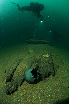 Divers at 30 meters, examining the exposed hull of an unknown wreck off the south coast, UK.. September 2009.