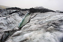 Water melting from the Solheimajokull, a glacier tongue from the Myrdalsjokull Glacier, South Iceland. July 2008