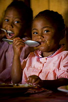 Children eating meal at Home for homeless women and orphans, Tananarive, Madagascar, October 2006