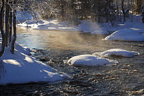Kikajoki River in winter, with light mist over the water, Finland, February 2009