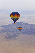 Two hot air balloons flying over the Namib desert, Sossusvlei, Sesriem, Namib desert, Namibia, August 2008