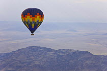 Hot air balloon flying over the Namib desert, Sossusvlei, Sesriem, Namib desert, Namibia, August 2008