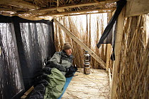 Manuel Presti in hide while photographing red breasted geese, Durankulak Lake, Bulgaria, February 2009