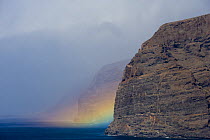 Acantilado de los Gigantes (Giant's cliffs) with a rainbow over the sea, West Tenerife, Canary Islands, Spain, December 2008