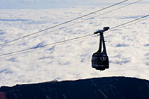 Cable car to the Teide volcano (Spain 3,718m) over clouds at sunrise, Teide National Park, Tenerife, Canary Islands, Spain, December 2008