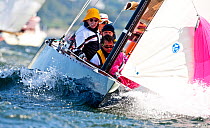 Concentration onboard a yacht in choppy water during the 6 Metre Class World Championships. Newport, Rhode Island, USA. September 2009.