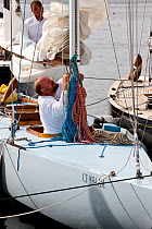 Preparations onboard a 6 Metre Class yacht for the World Championships. Newport, Rhode Island, USA. September 2009.
