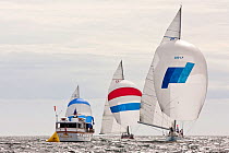 Three yachts and an official / spectator boat at the 12 Metre World Championships, Newport, Rhode Island, USA. September 2009.