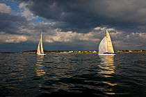 Yachts sailing on calm water, 12 Metre World Championships, Newport, Rhode Island, USA. September 2009.