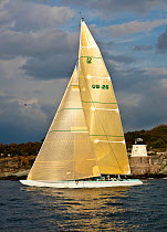 Yacht sailing near the Castle Hill lighthouse, 12 Metre World Championships, Newport, Rhode Island, USA. September 2009.